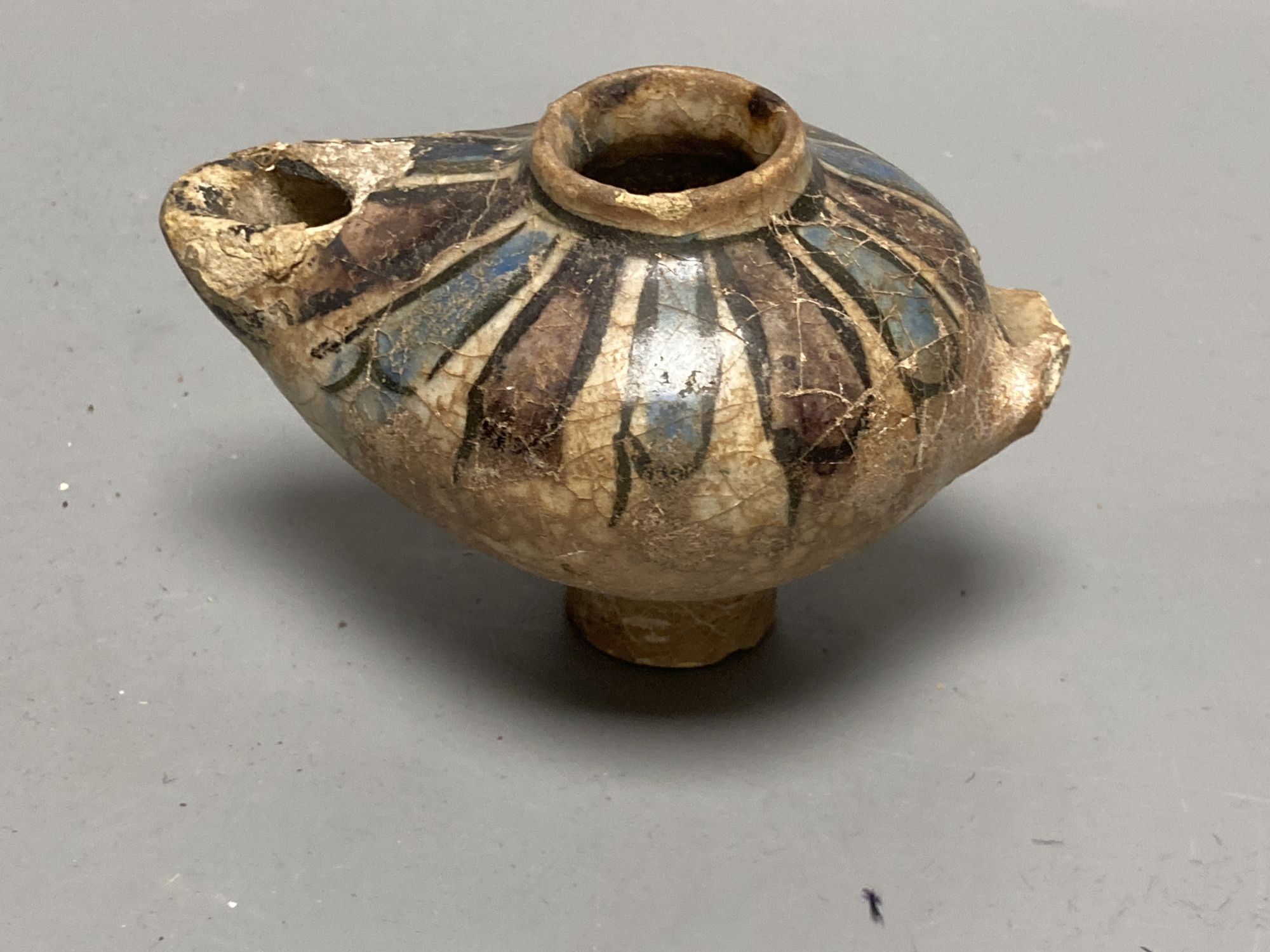 A group of Egyptian pottery fragments, Coptic period, together with a Syrian Islamic pottery oil lamp fragment